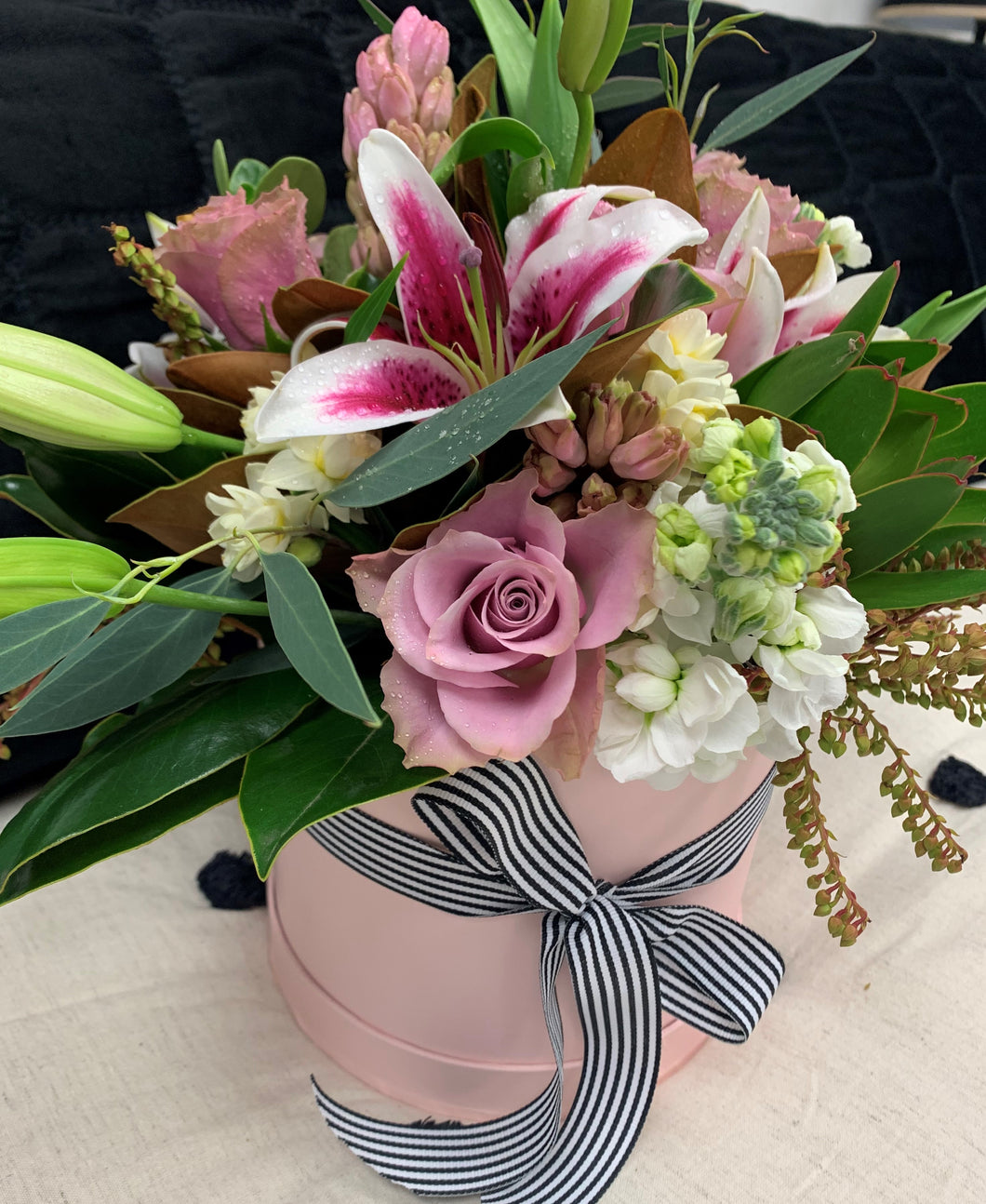 Flowers in a pink hat box
